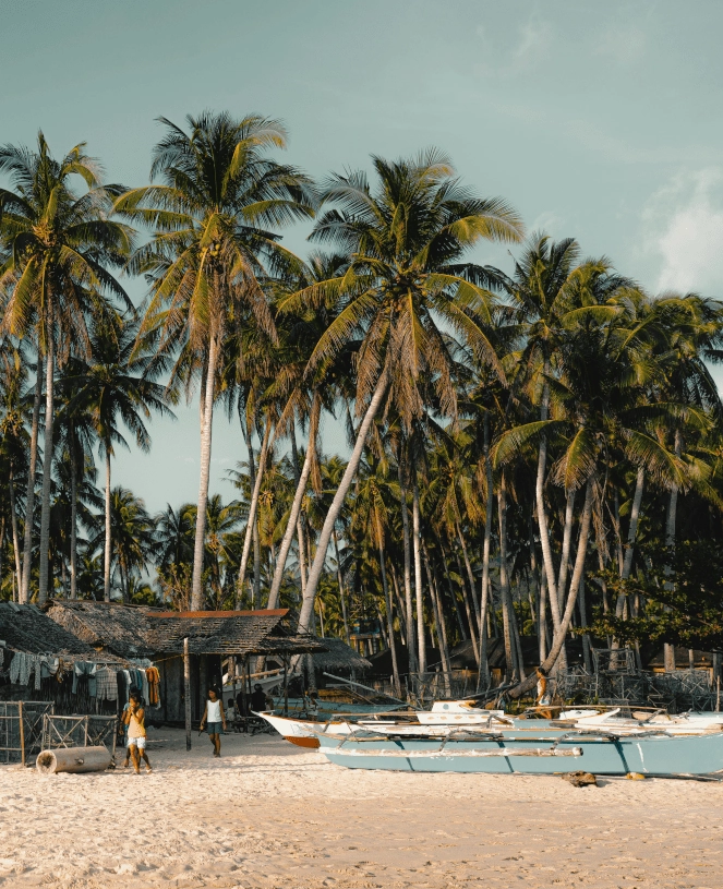 beach showing native wooden boat in the Philippines